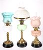 THREE VICTORIAN BRASS OIL LAMPS, the first with m