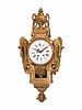 A Louis XVI Style Giltwood Cartel Clock