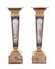 A Pair of Sevres Style Gilt Bronze Mounted Painted and Parcel Gilt Porcelain and Onyx Pedestals