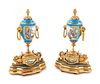 A Pair of Sevres Style Gilt Bronze Mounted Painted and Parcel Gilt Porcelain Urns