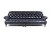 An Oversized Black Leather Upholstered Chesterfield Sofa