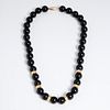 14k gold and black bead necklace