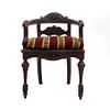 Curul. Francia. Siglo XX. En talla de madera de roble. Con respaldo semiabierto y asiento con cojín en tapicería de tela rayada.