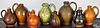 Eight miniature redware ovoid jugs