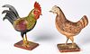 Carved and painted rooster and hen