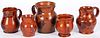 Five Pennsylvania redware pitchers/creamers
