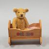 Teddy Bear. Germany. 20th century. Steiff. Plush toy. With brand button and crib.
