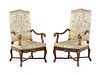 A Pair of Louis XV Style Carved and Parcel Gilt Walnut Fauteuils