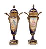 A Pair of Sevres Style Gilt Metal Mounted Painted and Parcel Gilt Porcelain Urns
