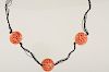Carved Coral Bead Necklace on Black Silk 