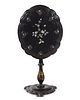 A Victorian Lacquered and Mother-of-Pearl Inlaid Tilt-Top Table