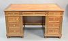Louis XVI style mahogany desk having brass mounts and tan tooled leather top, ht. 30", top 31 1/2" x 57".