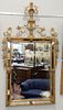Gilt framed mirror having mirrored frame, urn top with scrolling swag, 55 1/2" x 32".