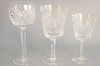 Thirty-four Waterford Alano crystal stems to include 12 large red wine goblets, 9 hock or tall stems, 11 white wine, 2 decanters, 6", 7", 7 1/4".