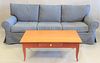 Three-piece lot to include upholstered contemporary sofa, lg. 92" along with an Ethan Allen coffee table and a contemporary desk.