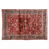 Tapete. Persia, siglo XX. Estilo Mashad. Elaborada en fibras de lana y algodón. Decorada con elementos vegetales y florales.