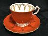 Aynsley porcelain Orange and Gold Cup and saucer made in England