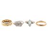 A Collection of Gold, Diamond & Blue Topaz Rings
