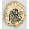 A HAND MADE AND ENGRAVED ANTLER WALRUS BUTTON