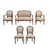 Sala. Francia. Siglo XX. Estilo Luis XVI. En talla de madera de nogal. Consta de: loveseat, par de sillones y par de sillas. Piezas: 5