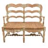 Loveseat in engraved wood with woven palm seat.