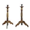 Pair of candleholders. 20th century. Polychrome wood. With lobed washers, compound shafts, tripod supports.