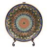 Platter. Mexico. 20th century. Made in talavera. Includes plate holder. Decorated with geometric and floral elements.