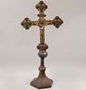 Crucifix. 20th century. Made in brass, wooden base. Decorated with foil applications. 33.4 x 9 x 9.8" (85 x 23 x 25 cm)