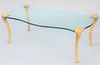 Glass Top coffee table having shaped top and gilded legs, ht. 16 1/2", top 25 1/2" x 47 1/2".