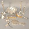 Nine-piece weighted silver lot to include dresser set, candlesticks, etc.