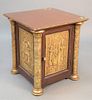 Egyptian-style low cabinet having one door with embossed panels, ht. 26", top 24" x 24". Estate of Thomas Izard.
