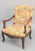 Heavily carved French-style armchair having needlepoint upholstery, ht. 41 1/2", wd. 30".