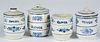 Four blue and white stoneware spice jars