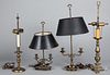 Four early brass table lamps