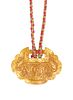 A CHINESE GOLD PENDANT, the oval pendant with scalloped edge and engraved C