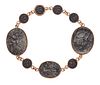 A BRONZE COIN BRACELET, the modified bronze coins, each with relief mouldin