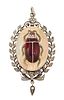 A LATE 19TH CENTURY GARNET BEETLE PENDANT, the oval pendant set with a garn