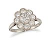 A DIAMOND FLOWERHEAD CLUSTER RING, the central round old brilliant cut diam