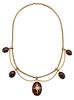 A 19TH CENTURY GARNET AND DIAMOND NECKLACE, the central oval cabochon set w