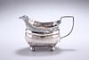 A GEORGE III SILVER CREAM JUG,?London 1810, with reeded edge and handle, ra