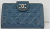 Chanel Blue Patent Leather Wallet, with silver tone button snap opening a blue leather interior with ten card holders and four bill...