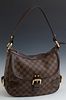Louis Vuitton Damier Ebene Highbury, in brown and tobacco Louis Vuitton monogram coated canvas, the brass zipper closure opening to...