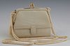 Vintage Judith Leiber 007 Ivory Crocodile Evening Bag, late 20th c., with a gold tone acorn kiss clasp opening to a ivory calf skin...