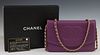 Chanel Purple Caviar Leather Wallet Purse, c. 2000, with a gold tone chain strap, the Chanel monogrammed snap flap opening to a purp...