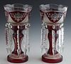 Pair of Cut-to-Clear Ruby Glass Lusters, c. 1900, the scalloped rims with floral and hatchwork panels, suspending long button and spear prisms, on a c