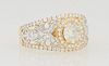 Lady's 18K Yellow Gold Dinner Ring, with a central .83 ct. round diamond, flanked by pierced diamond mounted sides and diamond mounted edge borders, t