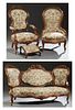 American Carved Rosewood Serpentine Double Chair Back Settee, c. 1880, and matching armchair, with deep relief carved grape, nut and leaf crests, the 