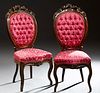 Pair of Victorian Carved Mahogany Side Chairs, c. 1870 with floral, morning glory, grape and leaf crests over tufted upholstered medallion backs, to b