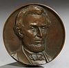 "Abraham Lincoln," 19th c., patinated bronze relief plaque, H.- 1 in., Dia.- 7 in.