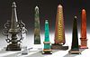 Group of Seven Obelisks, 19th and 20th c., consisting of a faux malachite example; a brass mounted black ceramic example; an iron example on a stepped